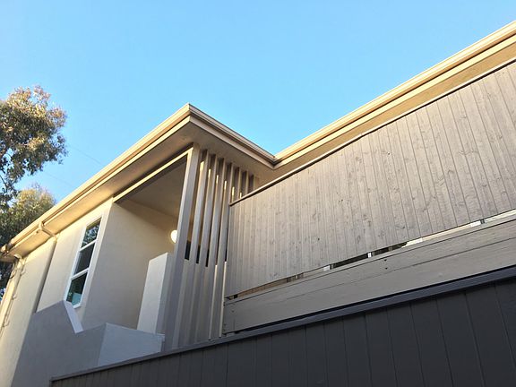 Building refinished inside and out; view of porch/balcony.