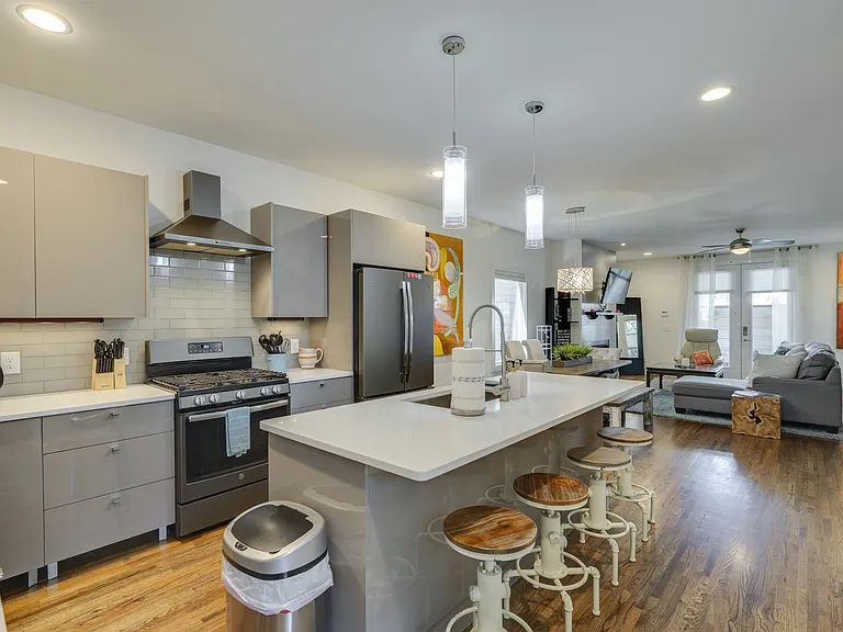 Spacious open-concept kitchen, fully stocked with everything you'll need to prepare and enjoy meals. Designed for gathering, it flows seamlessly into the dining and living areas, creating the perfect space to spend time with family and friends.