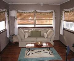 Awesome sun-room overlooks back yard -- newly refinished hardwood floor!