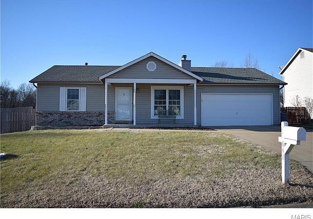 Adorable Ranch Home with vinyl/brick facade and an oversized 2 car garage.