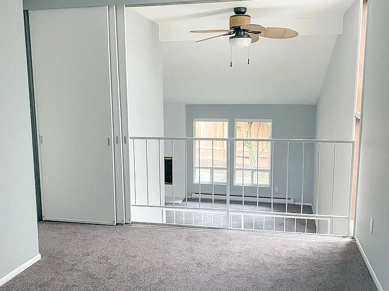 view from 2nd bedroom with loft doors open