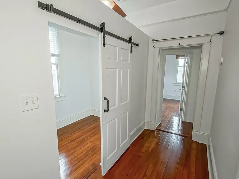 Bedroom #2 with barn doors upstairs