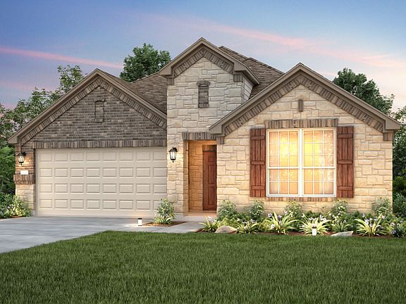 The Dayton, a one-story home with 2-car garage, shown with Home Exterior D