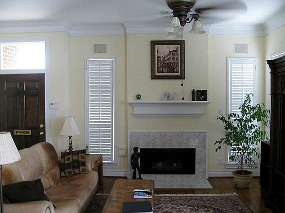 FORMAL LIVING. First floor living. Oak hardwood floors, gas log fireplace, double crown molding, pla