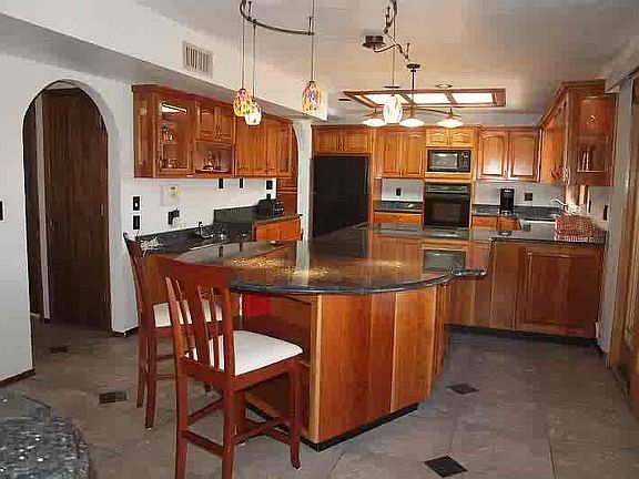 Upgraded Kitchen, granite tops, cherry cab., copper  accents                  