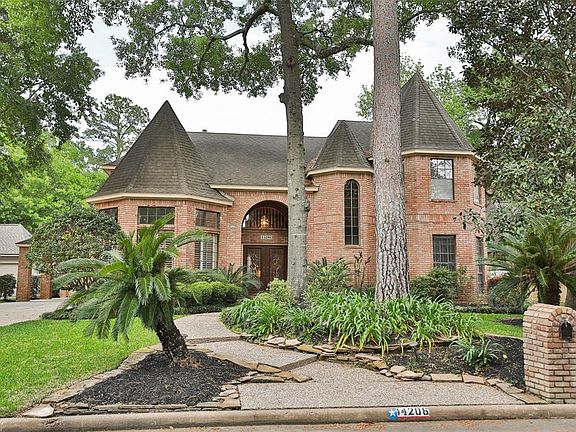 Beautifully landscaped front yard on a quiet tree lined cul-de-sac.