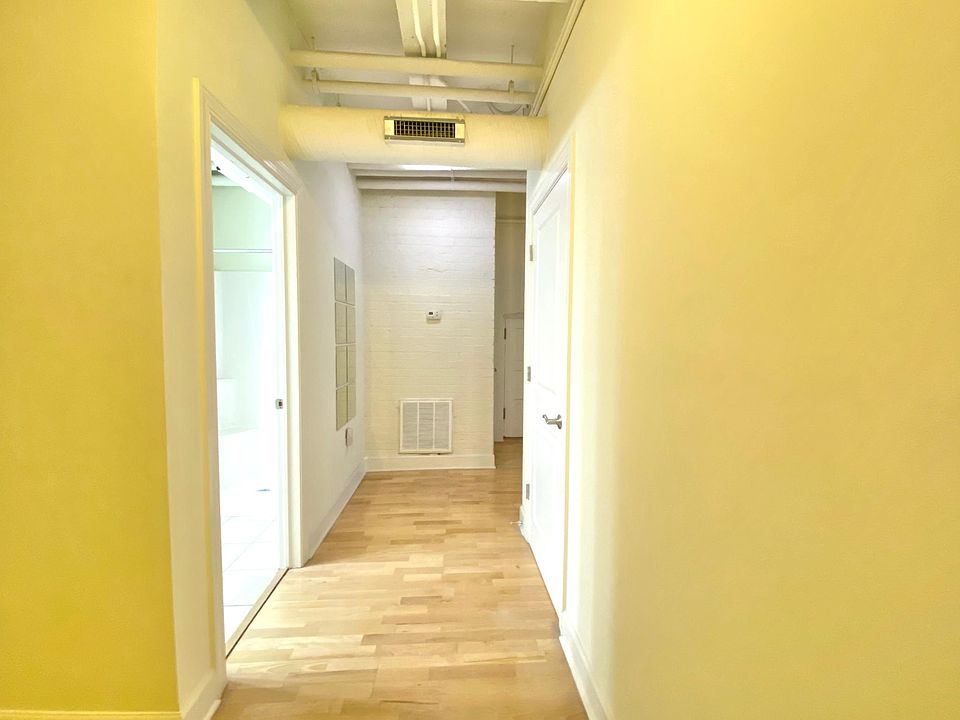 Entrance foyer down hall with first bath on the left and closet on the right.