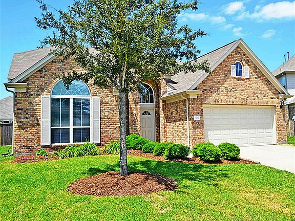 Landscaped entrance greets you as you enter home.