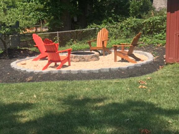 Pea gravel fire pit and storage building
