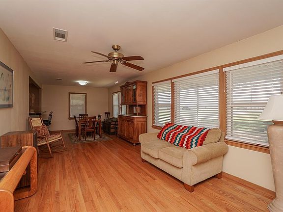 Wonderful Dining and Formal Living area overlooking your awesome front yard!!! Real wood flooring, tons of natural lighting!!