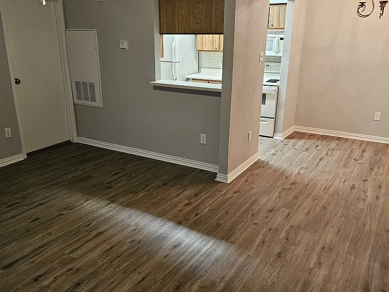 View of dining and kitchen from the front door