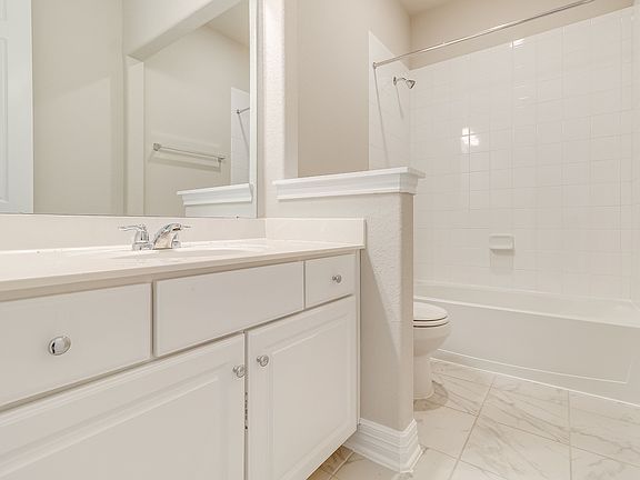 Secondary bath. Note Sample product photo - actual exterior and interior selections may vary by hom