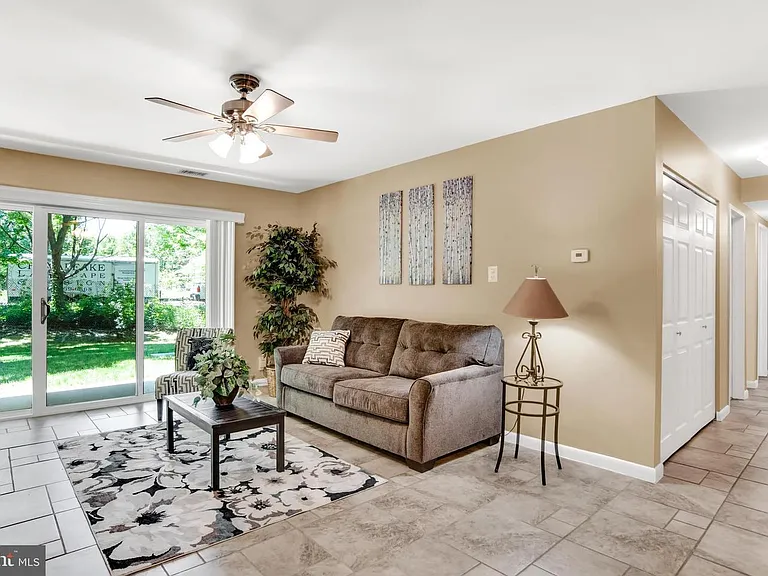 Living room with sliders leading to patio.