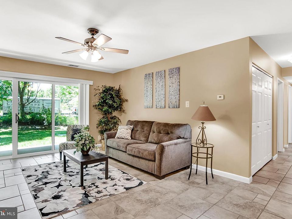 Living room with sliders leading to patio.