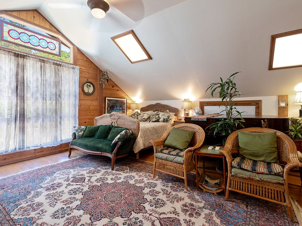 High ceilings, ceiling fans, skylights. Living Room, high speed internet, TV. bedroom & grand piano area.
