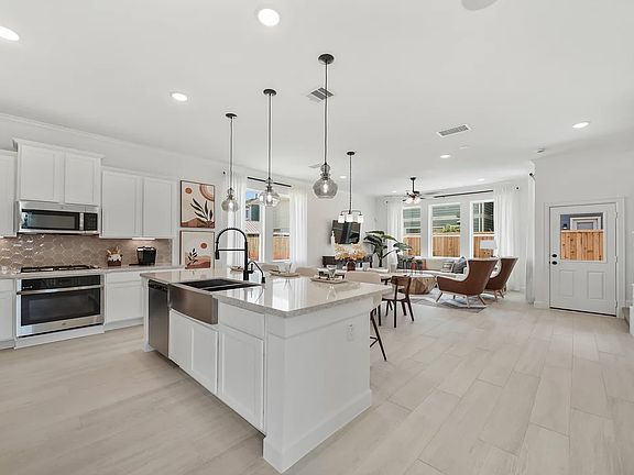Kitchen with island and pendant lighting