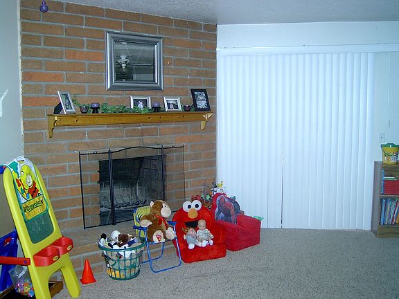 brick fireplace in family room