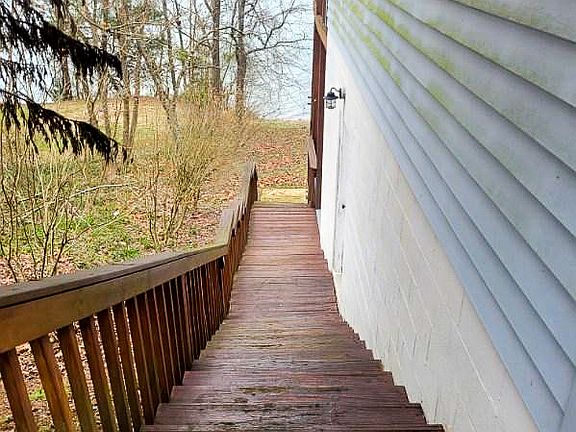 Side stairs front the front of the house to the backyard.