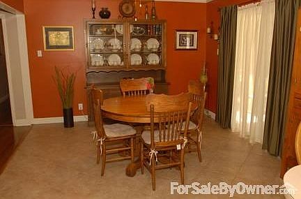 Dining Room
						:
						Dining room opens to kitchen and living room. New tile in dining and kitchen.