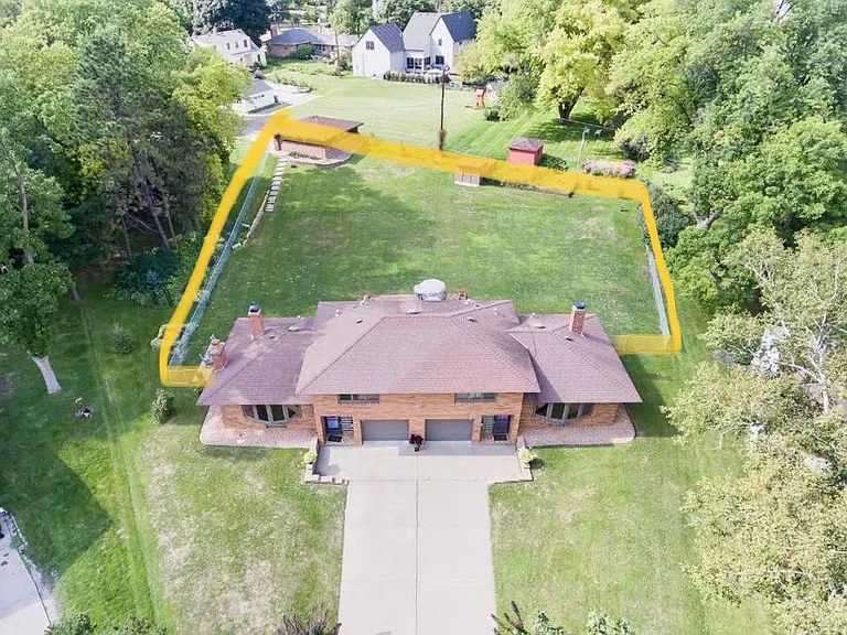 Highlighted area is fenced in. Raised garden located outside the fence.