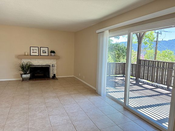 Living room with wood burning fireplace