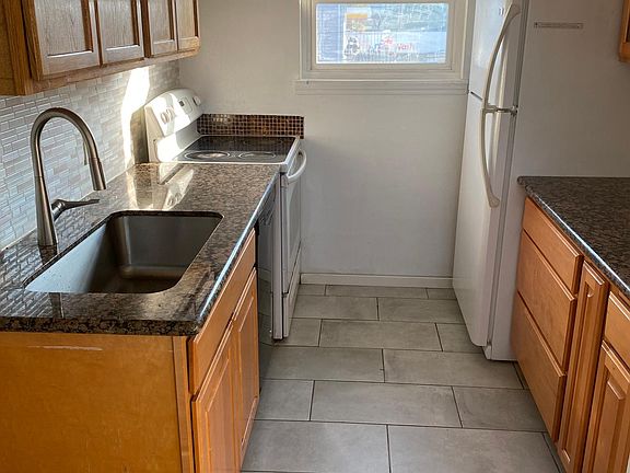 granite countertop , cabinets, dishwasher, hood and stove installed about 2 years ago