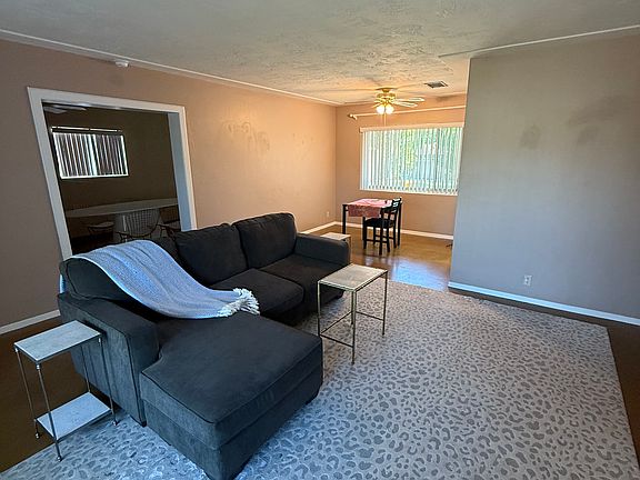 Different perspective from entryway showing dining area, living room and bonus room through doorway.