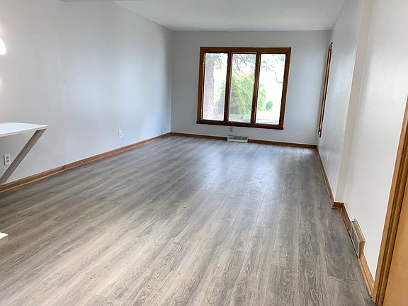 Bedroom #1 - brand new flooring, large built-in L shape table, 3 large windows