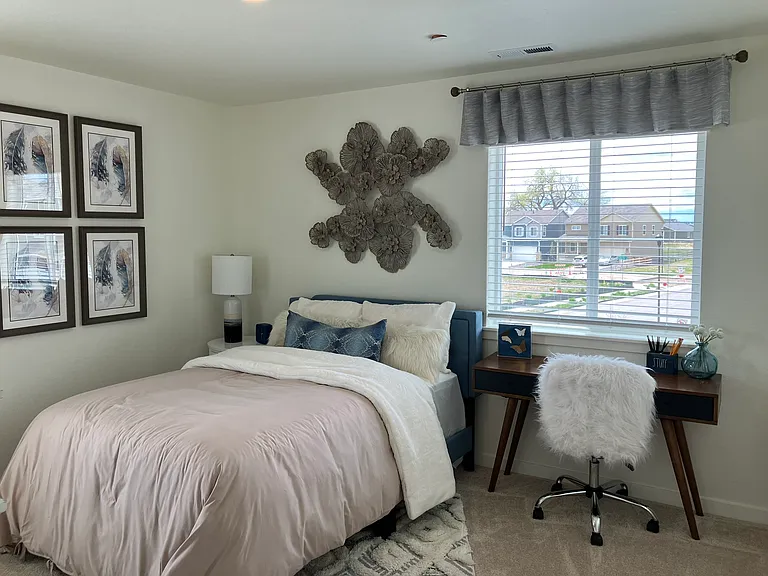 Sample of same floor plan, different finishes, staged with furniture.