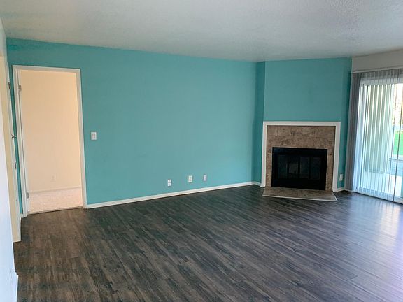 Living Room with Wood Burning Fireplace