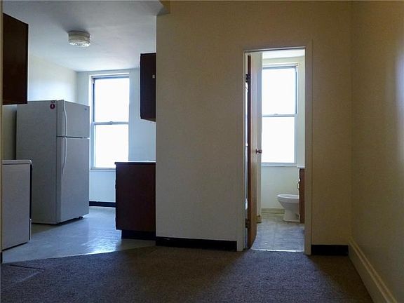 Entry into 2nd Floor unit with wall-to-wall carpet