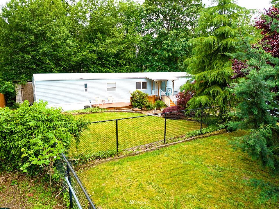 Paved Driveway to Gated yard with an extra inner fenced yard.  A little piece of the country near the city.>