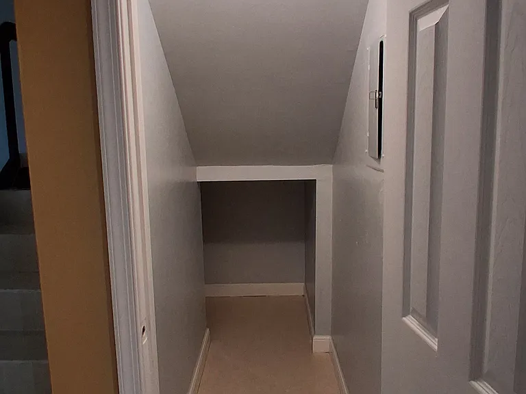 Storage below stairs - breaker/water heater