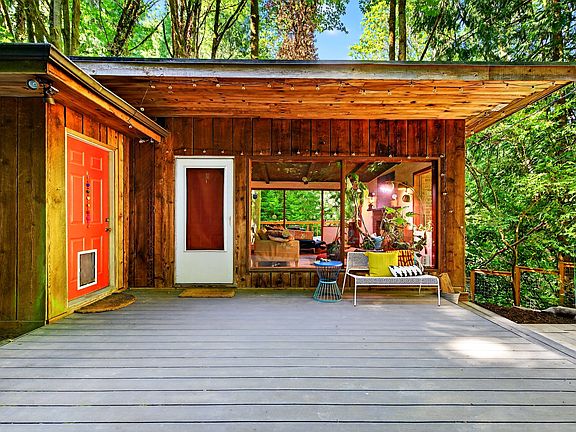 Make this gorgeous home in the woods yours!