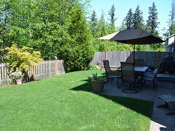 Private, fenced back yard on green belt