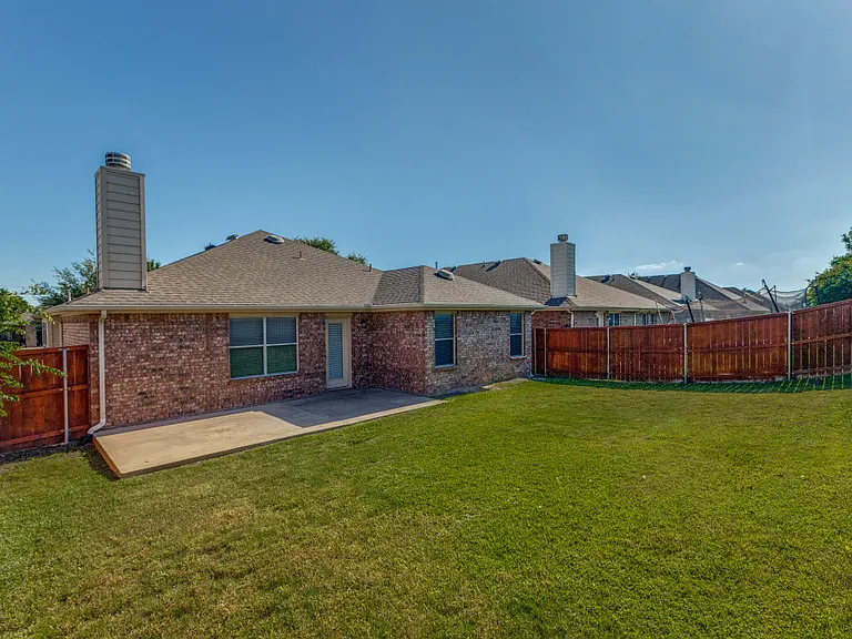 Fenced backyard with expanded patio