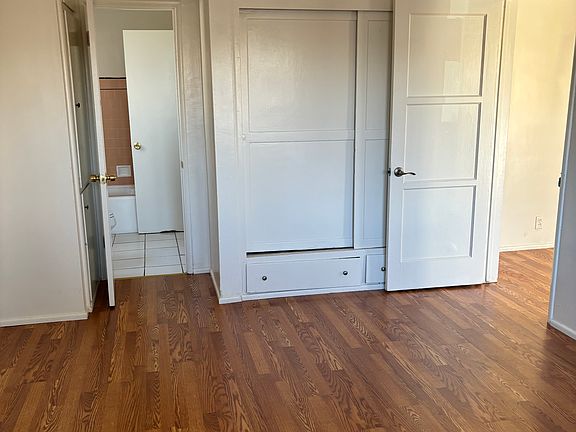 Bedroom with view to bathroom and closet.