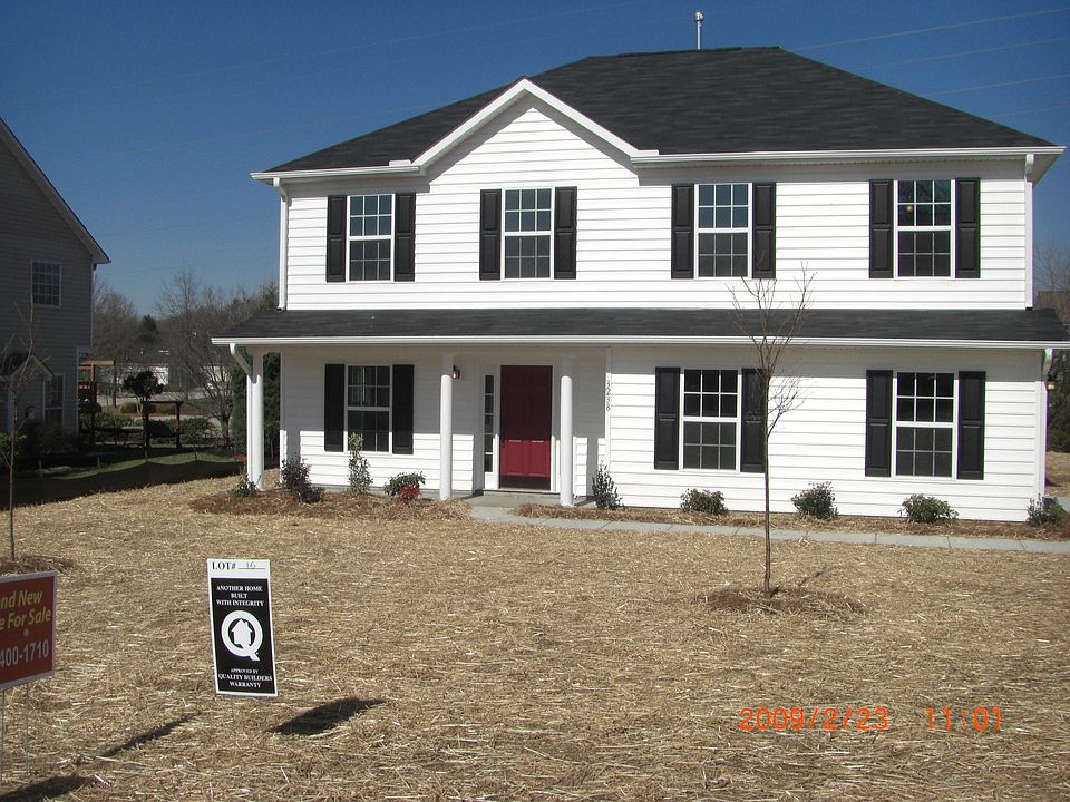 Before grass has come up and cherry trees blossom, side load garage