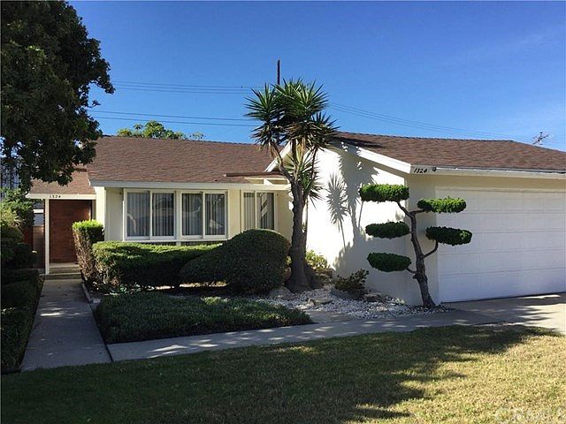 Welcome to 214th Street!  The inviting curb appeal of this lovingly maintained home is just one reason...
