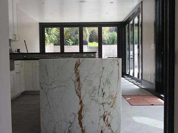 Italian Marble Island in the kitchen with family room in back.