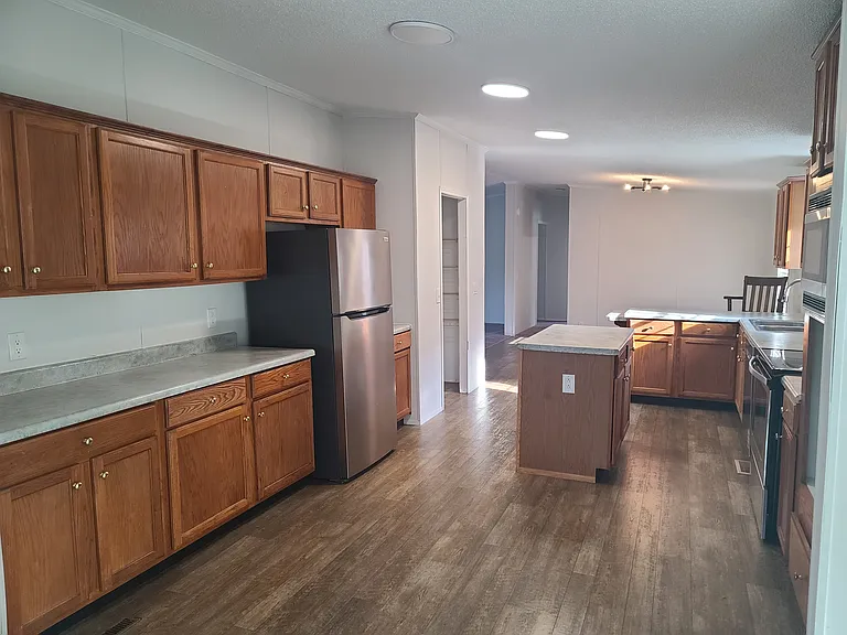 Lots of cabinets with island, new flooring