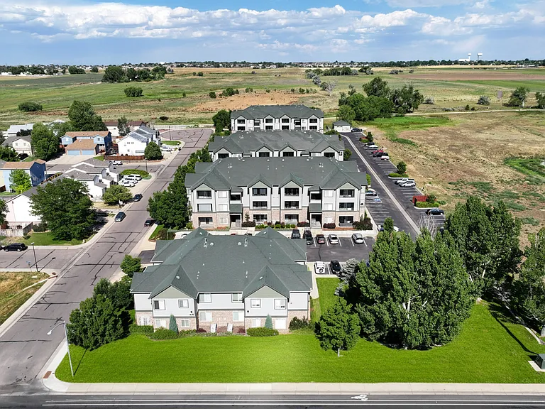 Walking paths and field can be seen behind Michael Place Apartments