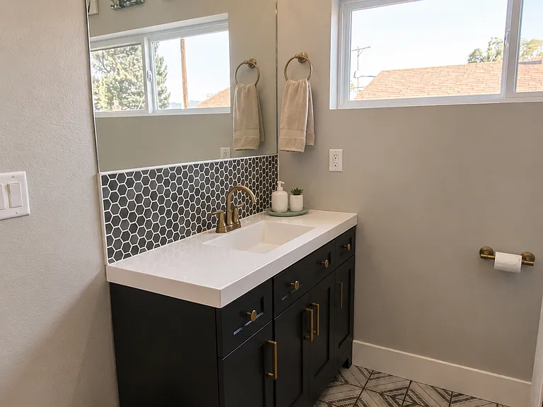 Large vanity with storage. Bohemian-style floor tile for that fun flair!