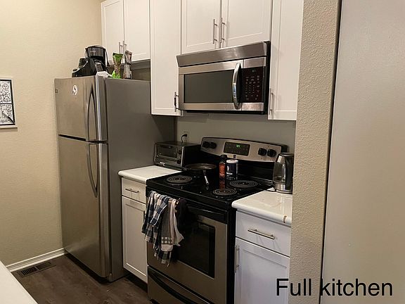 Comes with updated appliances - refrigerator, stove/oven, microwave