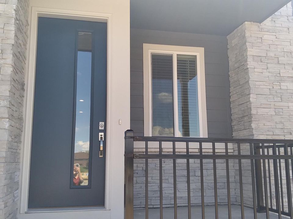 Front entrance with fenced porch area.