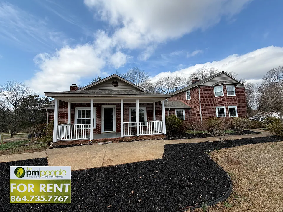 Enjoy a covered front porch, easy access to parking and garden beds that spring to life in warm weather!