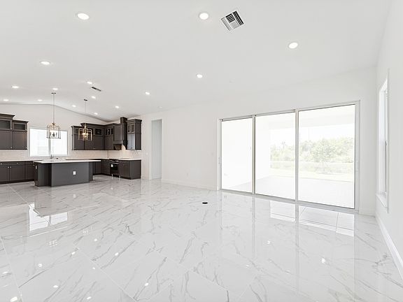 Open concept living spaces with vaulted ceiling