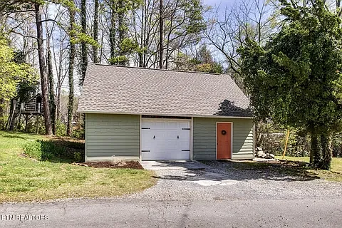 Large oversized one car garage with finished room above.