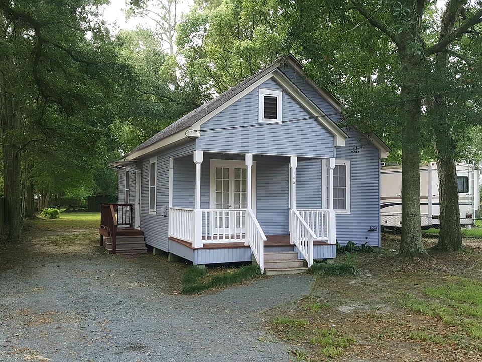 Front of house with porch.