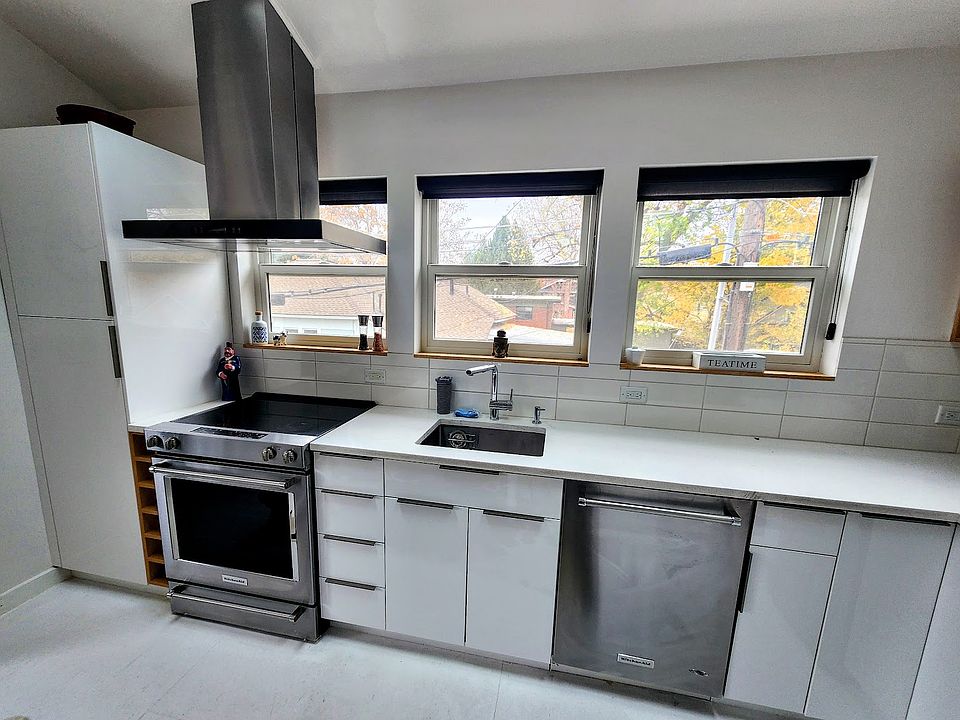 Kitchen: Kitchenaide appliances, pantry to the left with microwave.